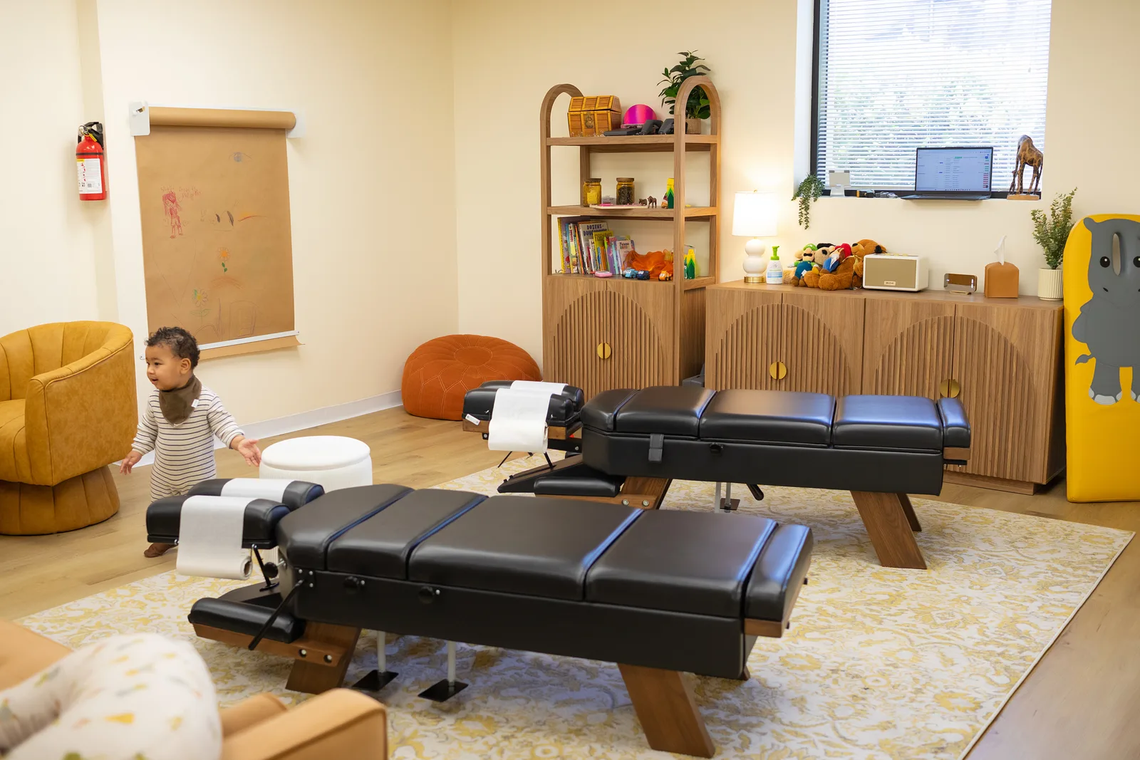 Young child exploring the family-friendly Taproot Chiropractic office in Temecula