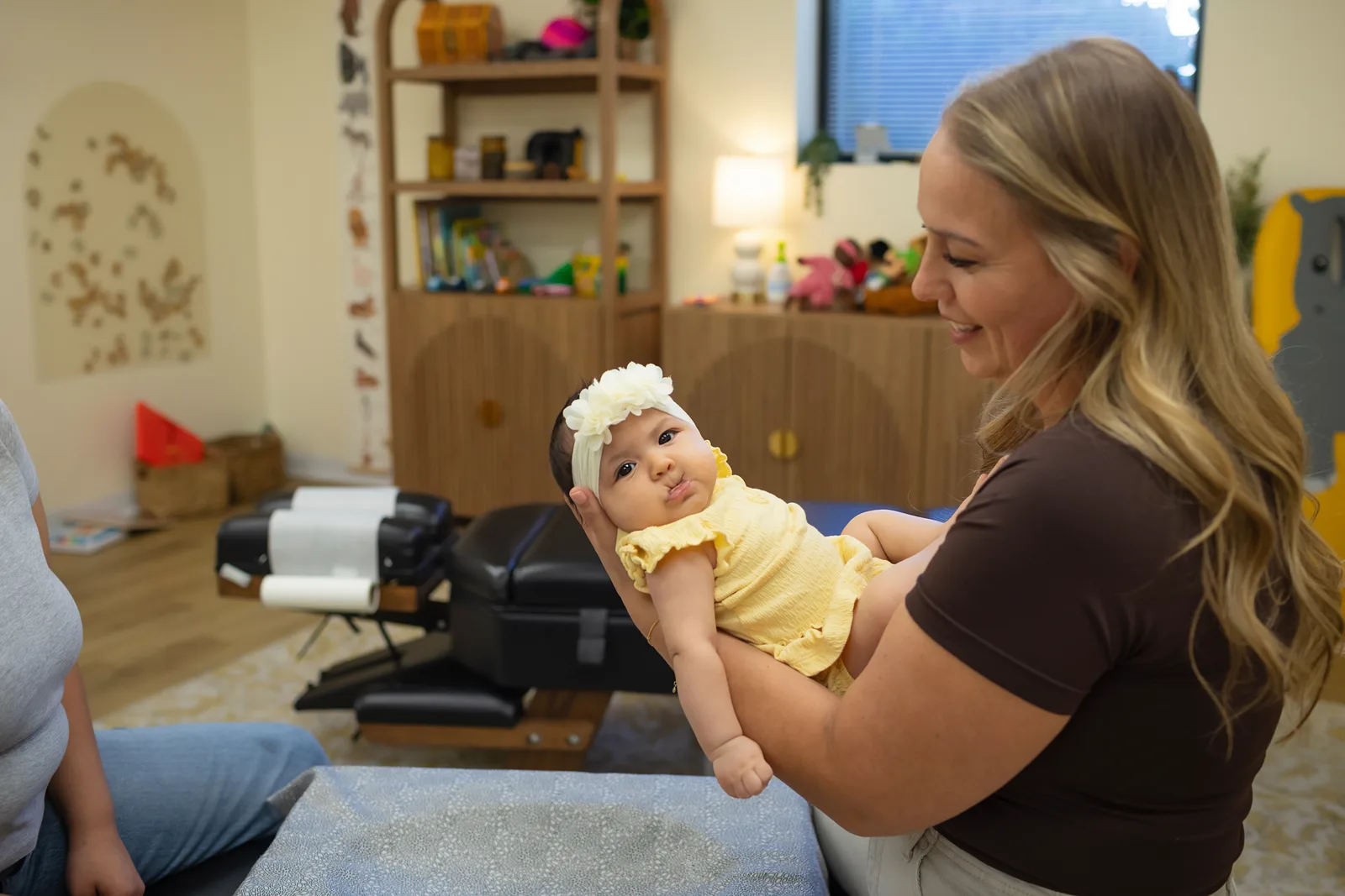 Dr. Jennifer Gordon providing a gentle infant chiropractic assessment in Temecula