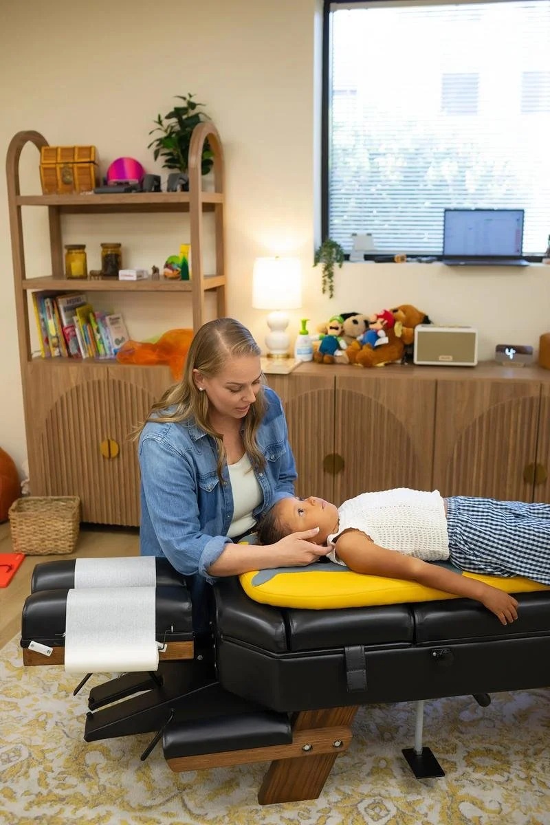 Dr. Jennifer Gordon gently supporting a child's head and neck