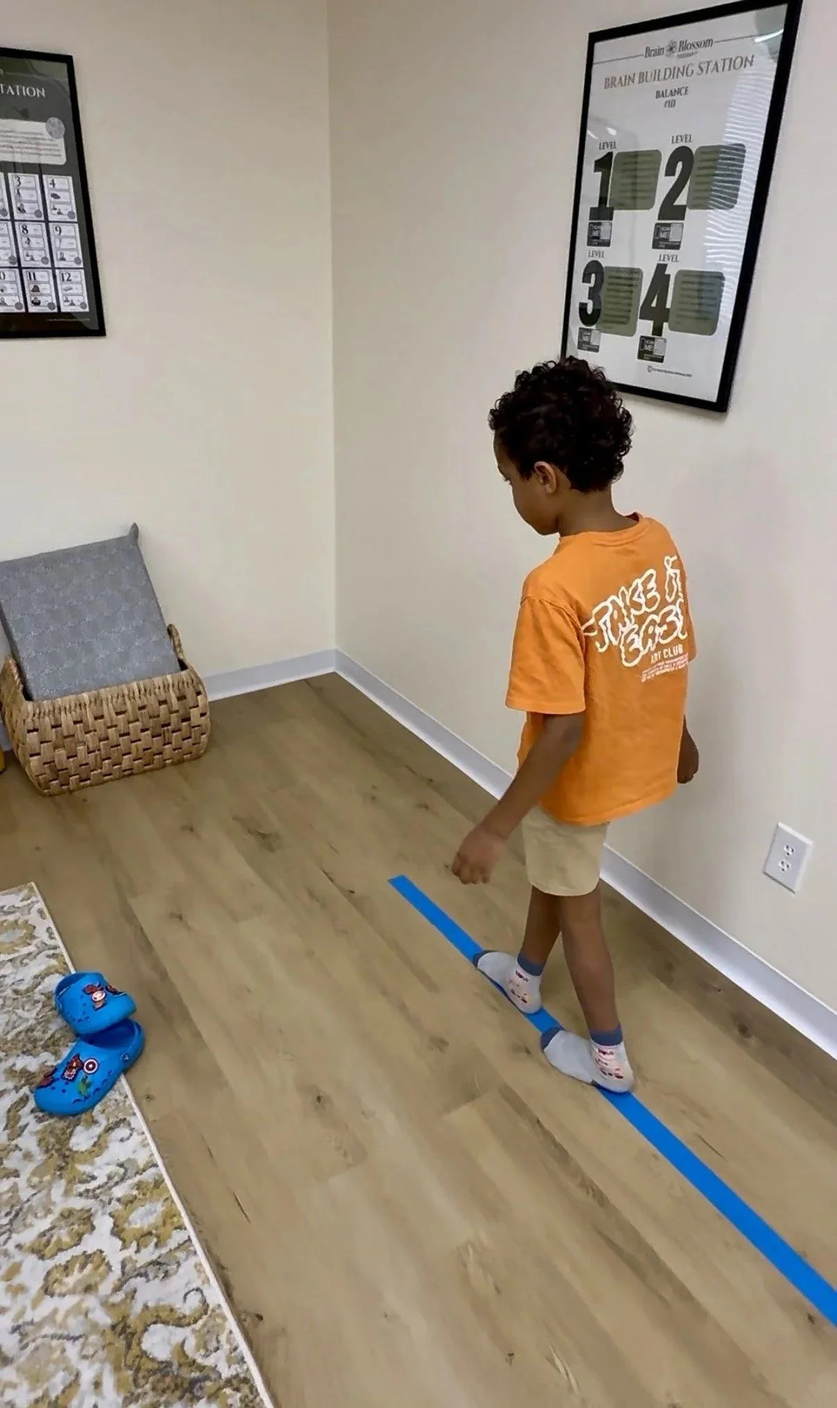 Young boy walking along a balance line