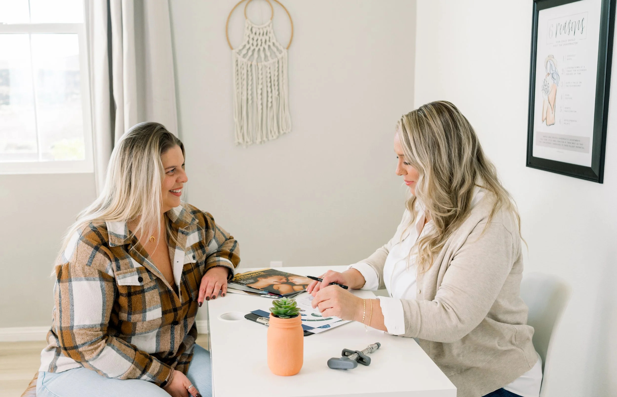Dr. Jennifer Gordon reviewing paperwork with a patient