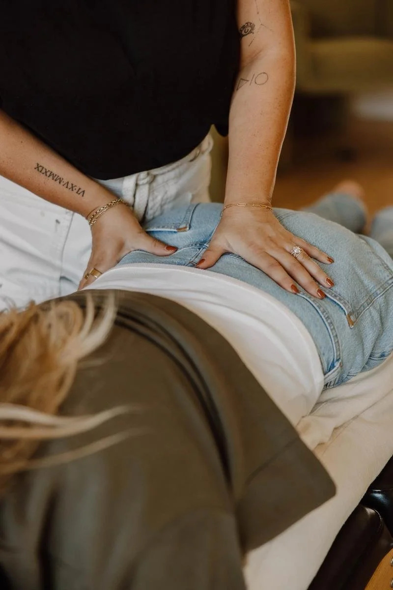 Dr. Jennifer Gordon adjusting a pregnant patient's lower back