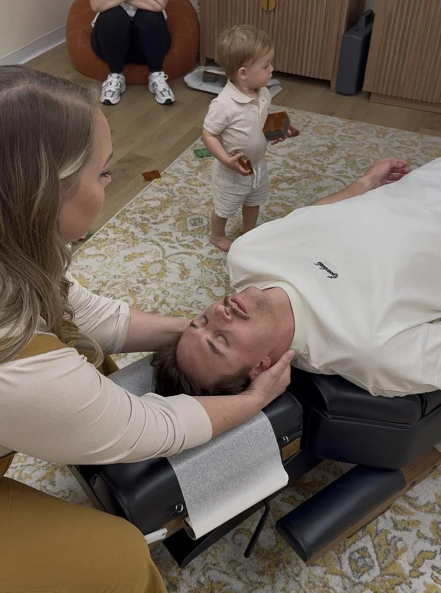 Dr. Jennifer Gordon providing a chiropractic adjustment to an adult patient